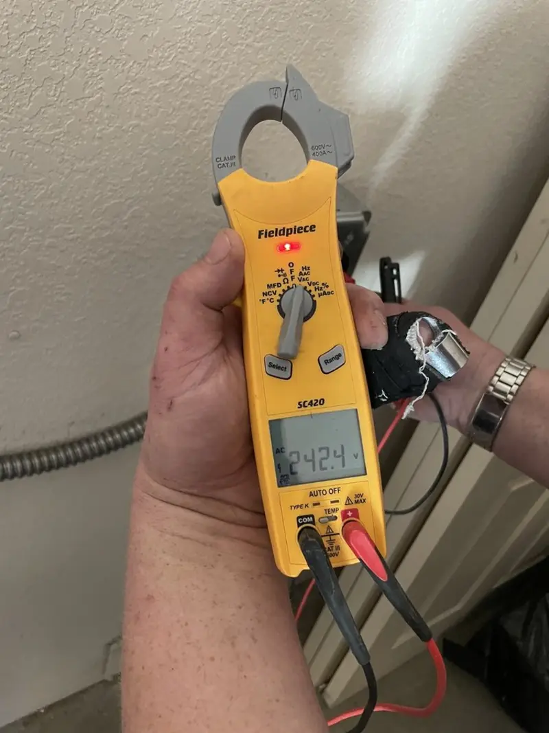Voltage testing with clamp meter during Electrical Installation Services in Grand Terrace